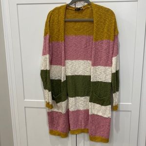 Duster pink, green sweater